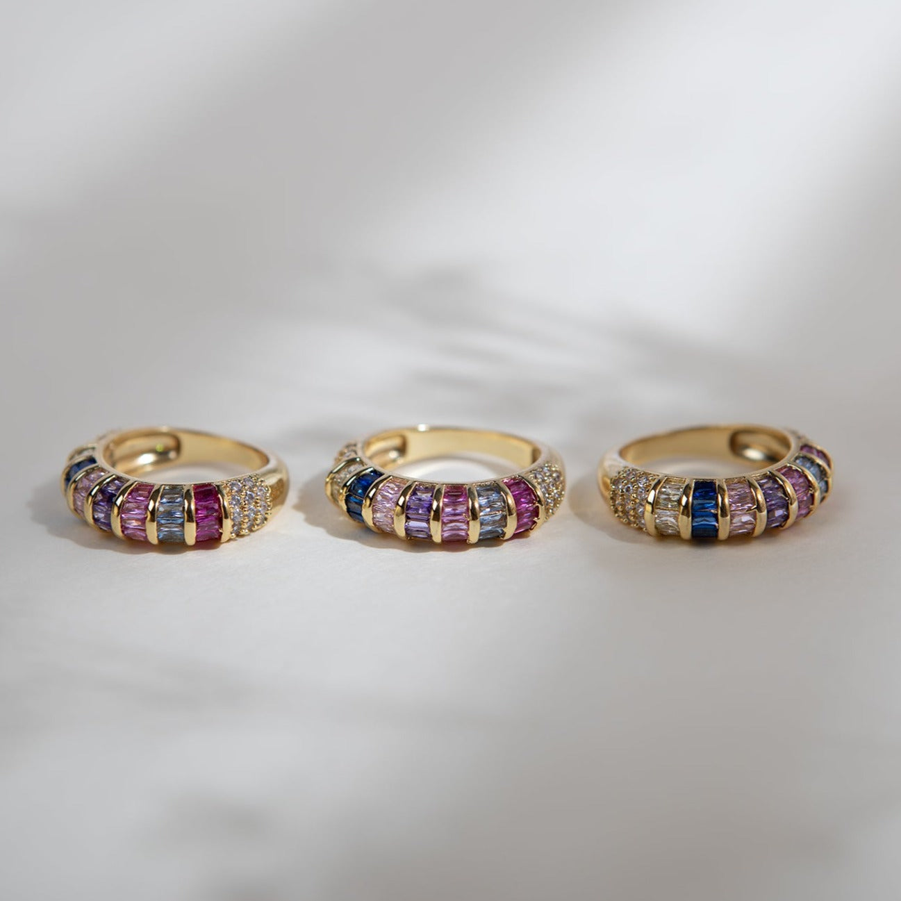 Multi-coloured baguette crystal and gold rings