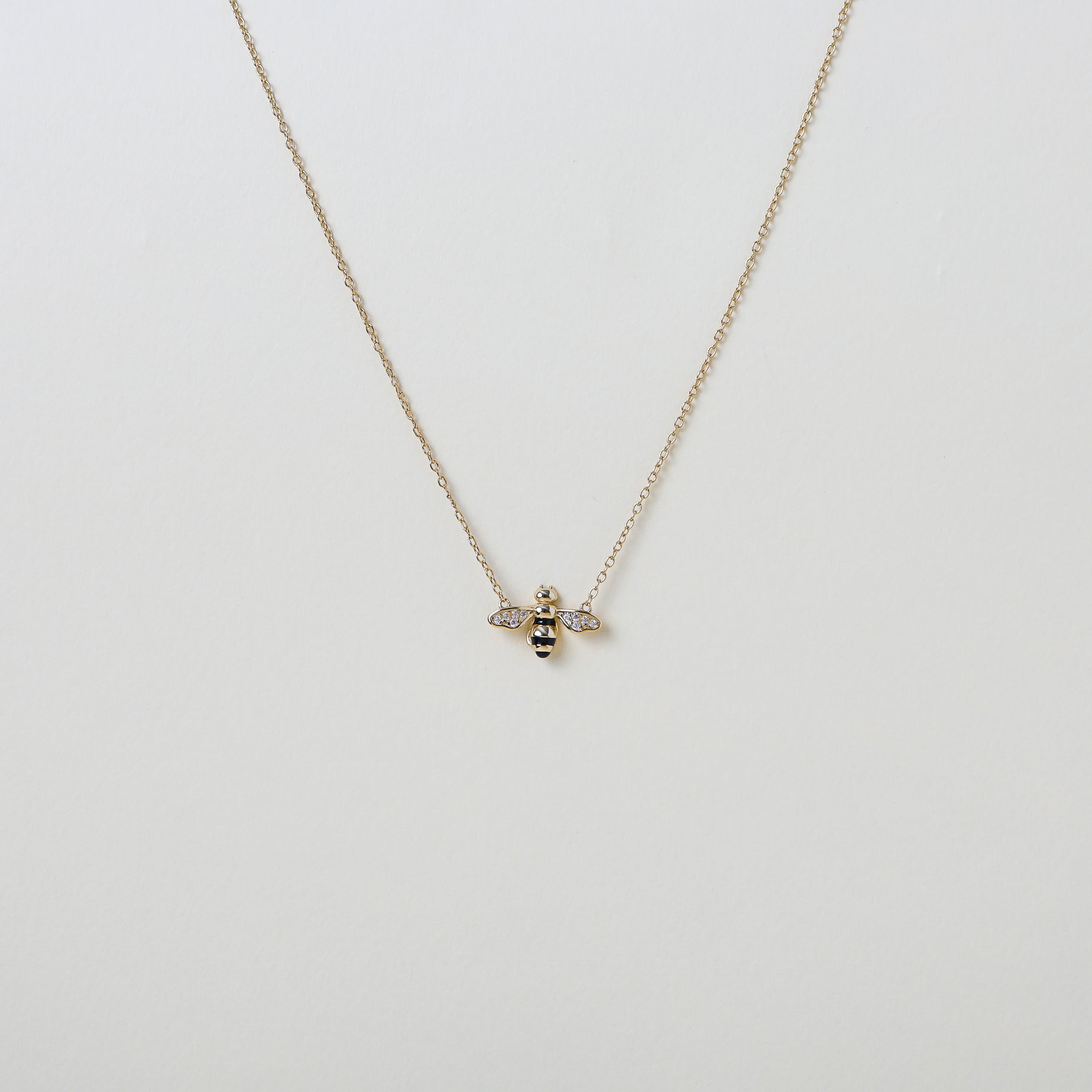 Gold chain with gold and crystal accented honey bee pendant