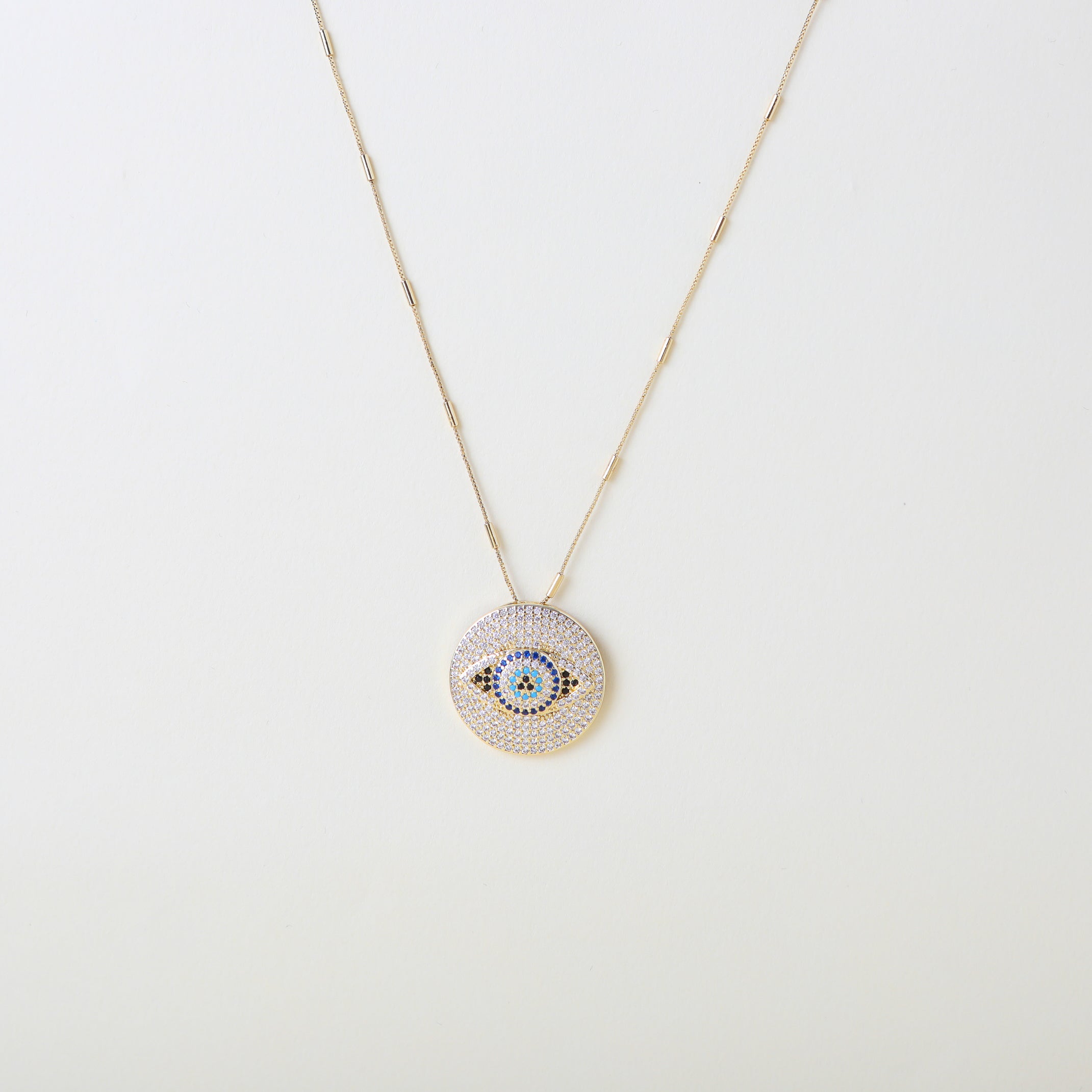 Stunning pave crystal Santorini Eye pendent necklace with a tube accented necklace