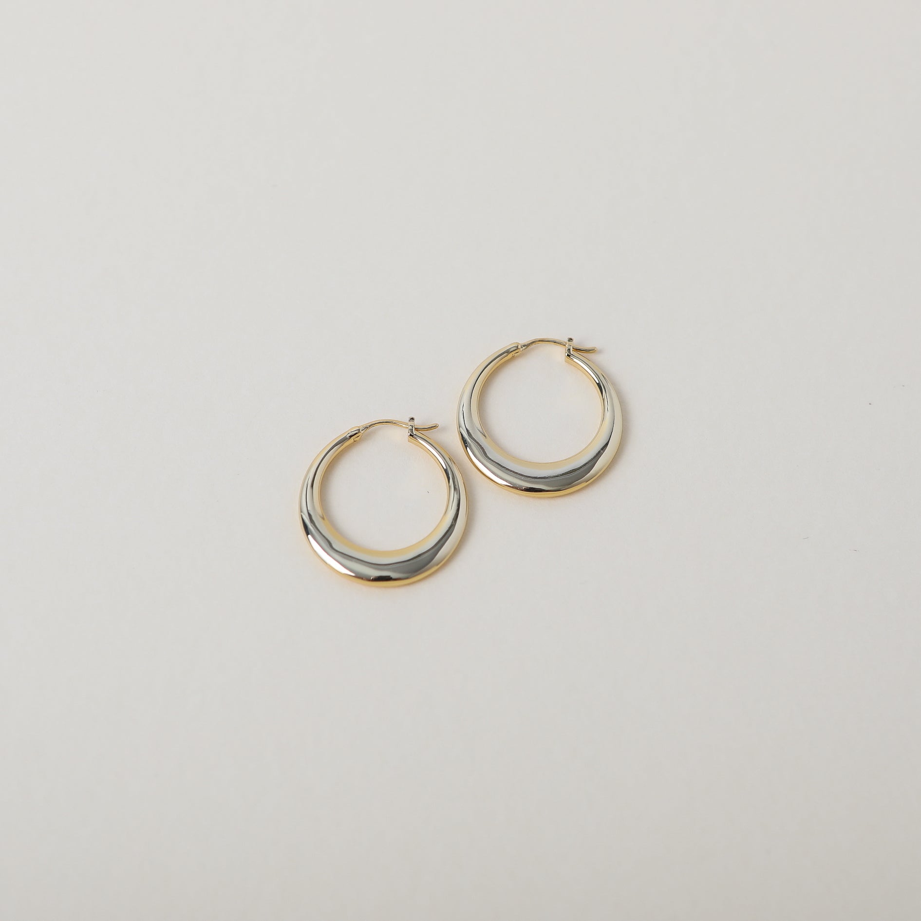 Gold geometric bag hoop earrings