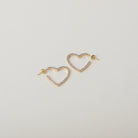 Crystal accented heart hoop earrings
