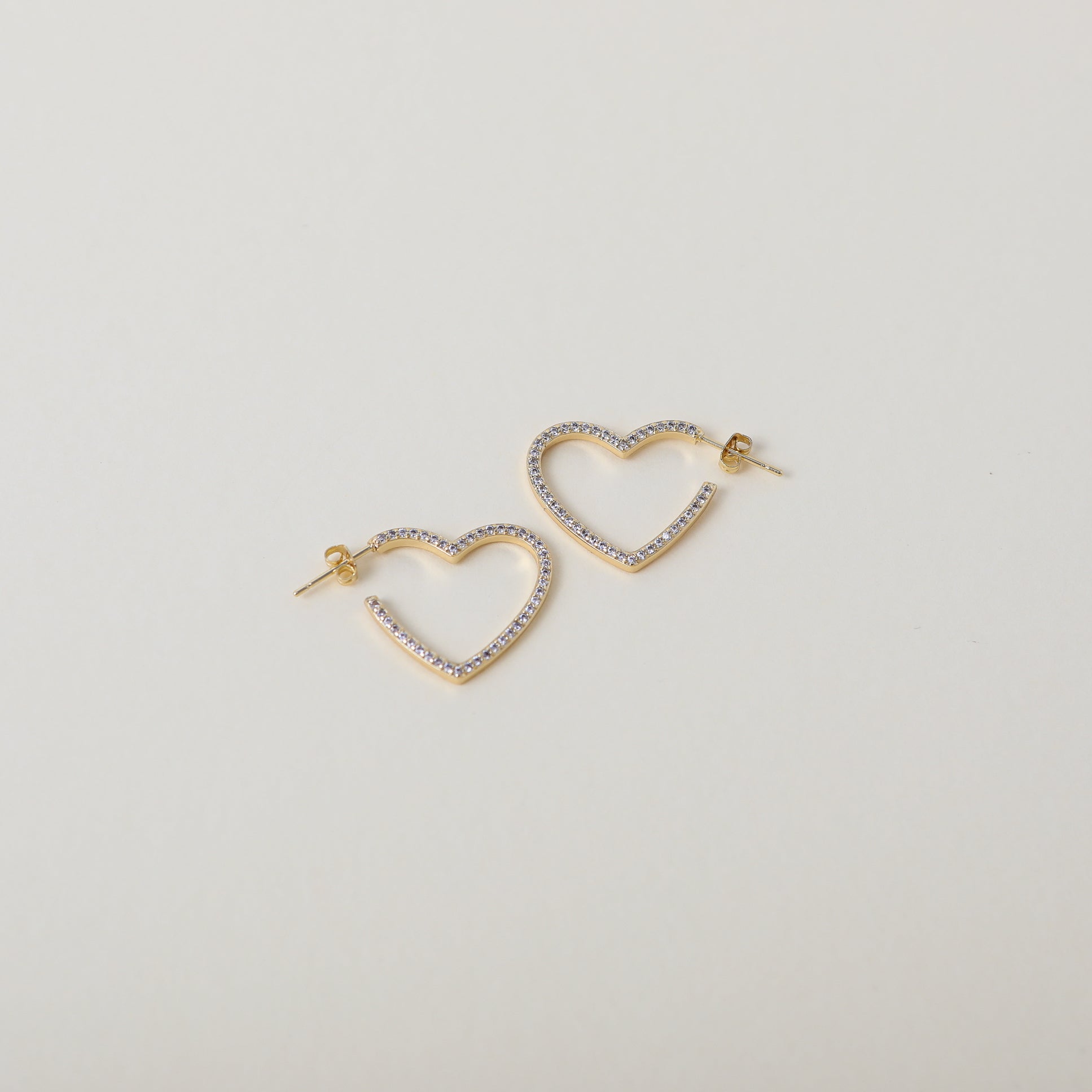 Crystal accented heart hoop earrings