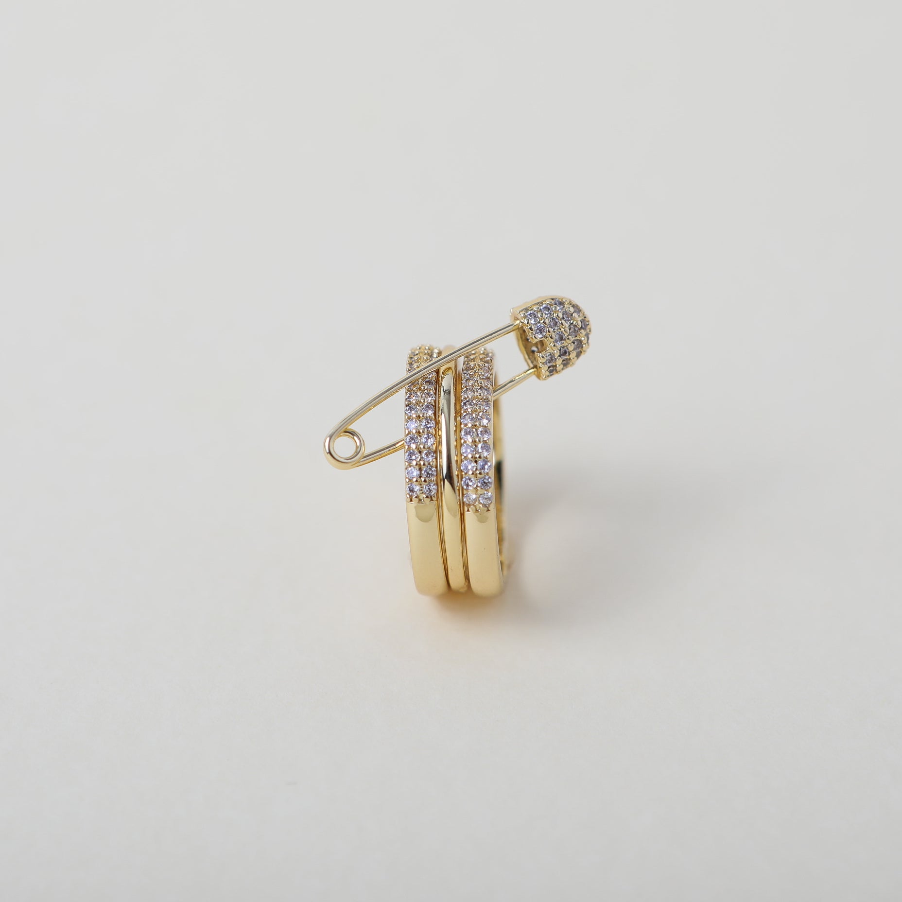 Stackable gold and crystal accented safety pin rings