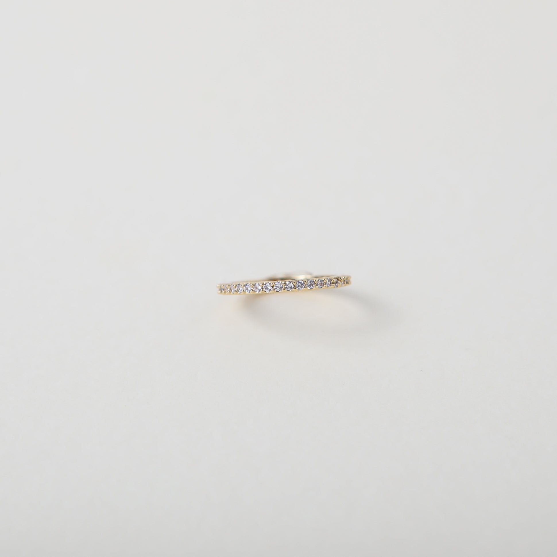 Crystal accented gold eternity ring