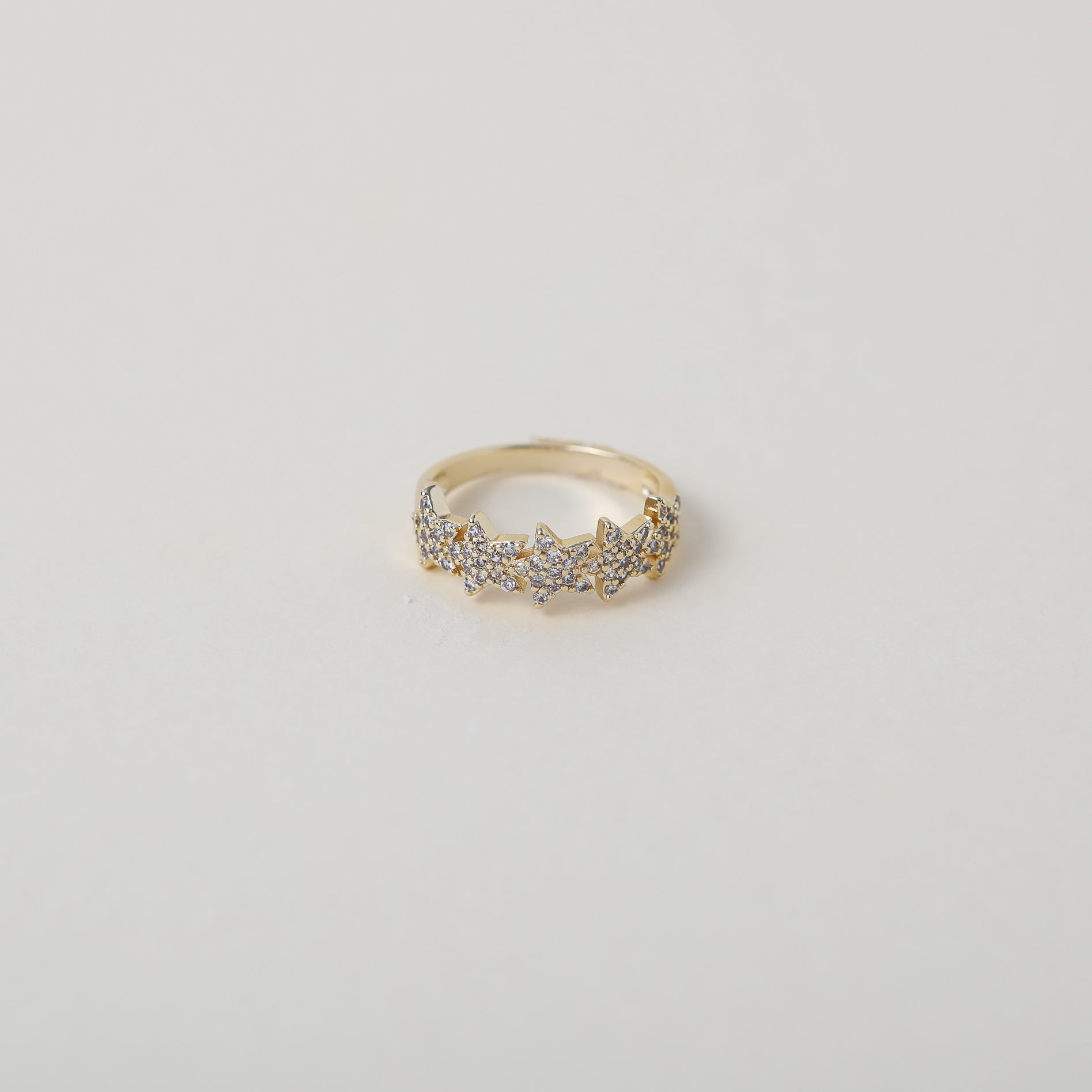 Crystal accented gold star ring
