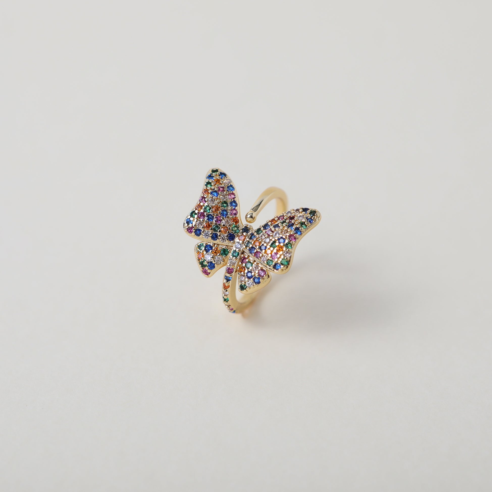 Adjustable butterfly ring with rainbow crystal embellishments