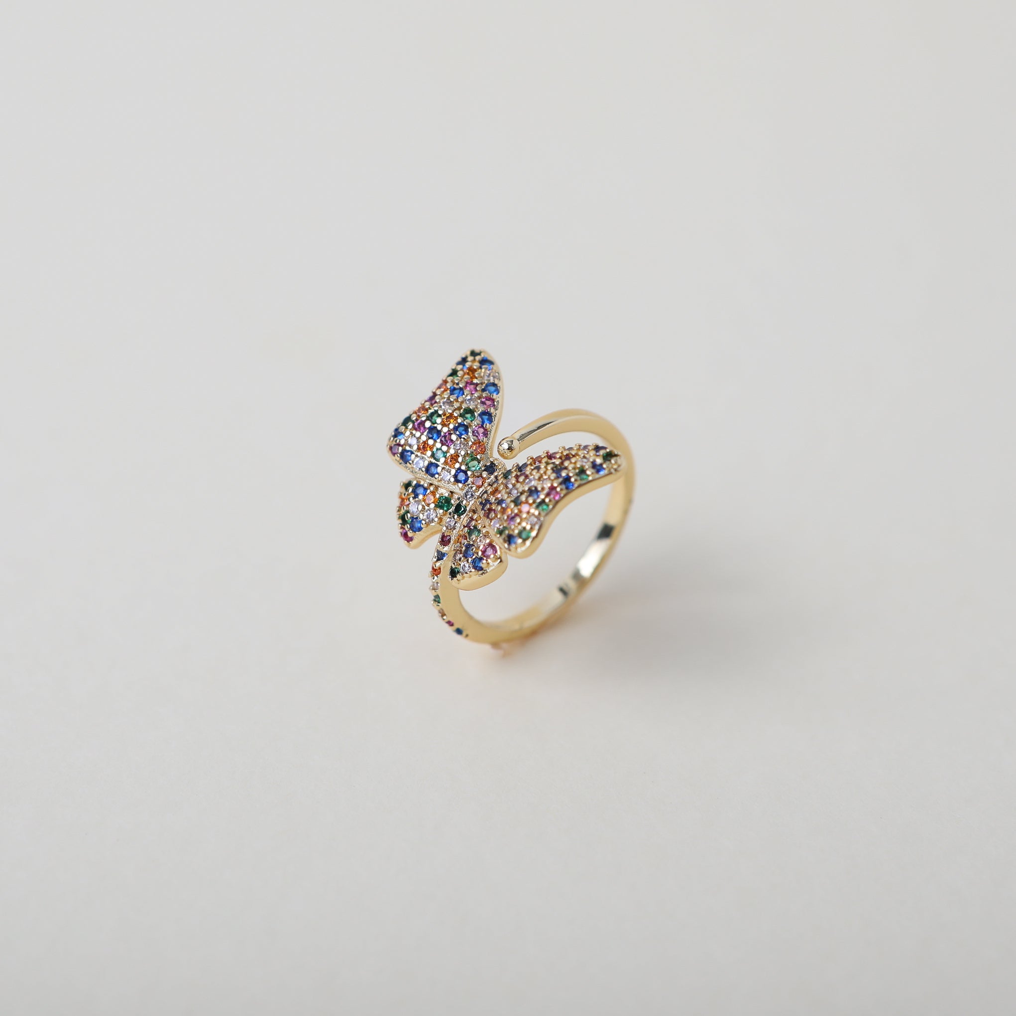 Adjustable butterfly ring with rainbow crystal embellishments