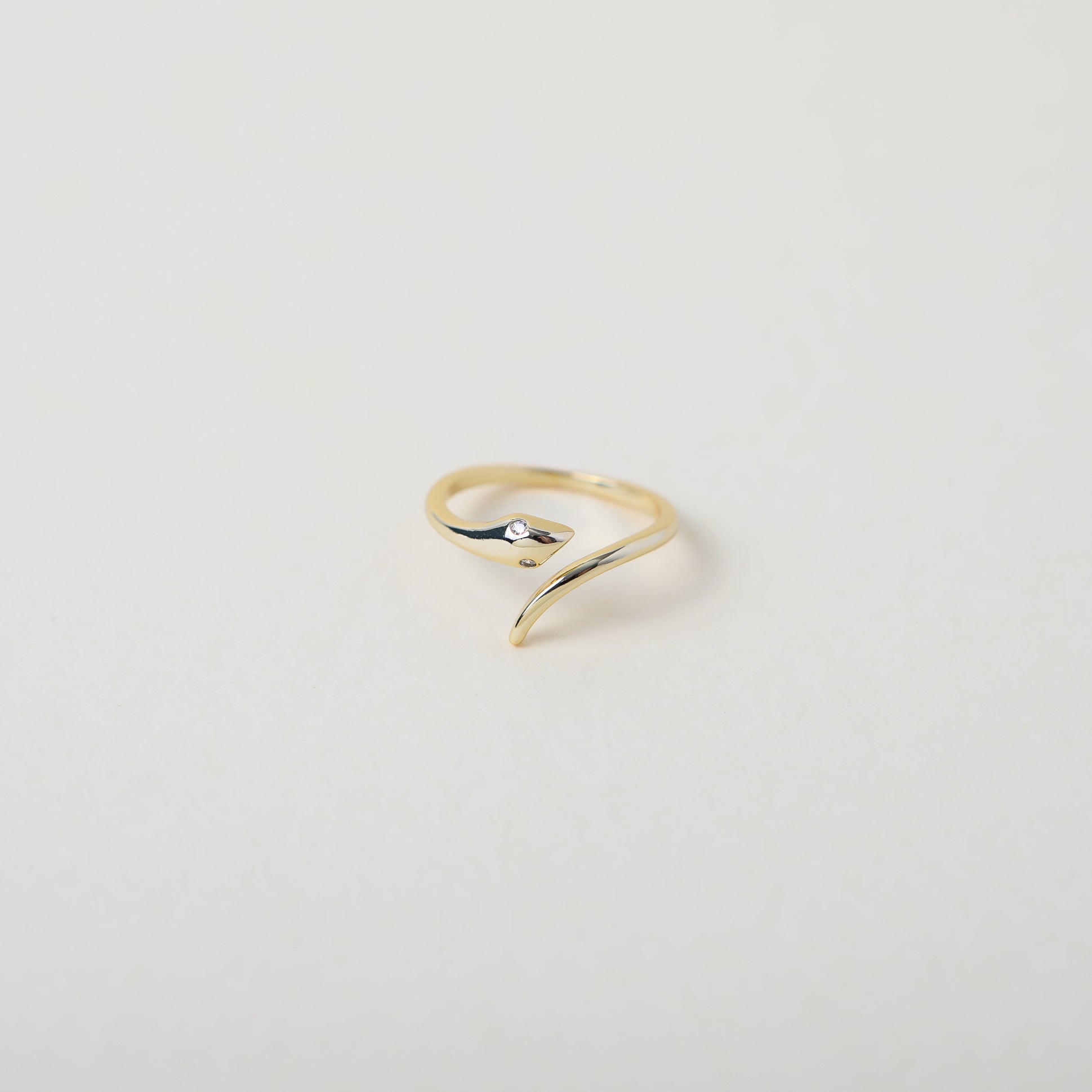 gold open claw twisted serpent ring with crystal eyes