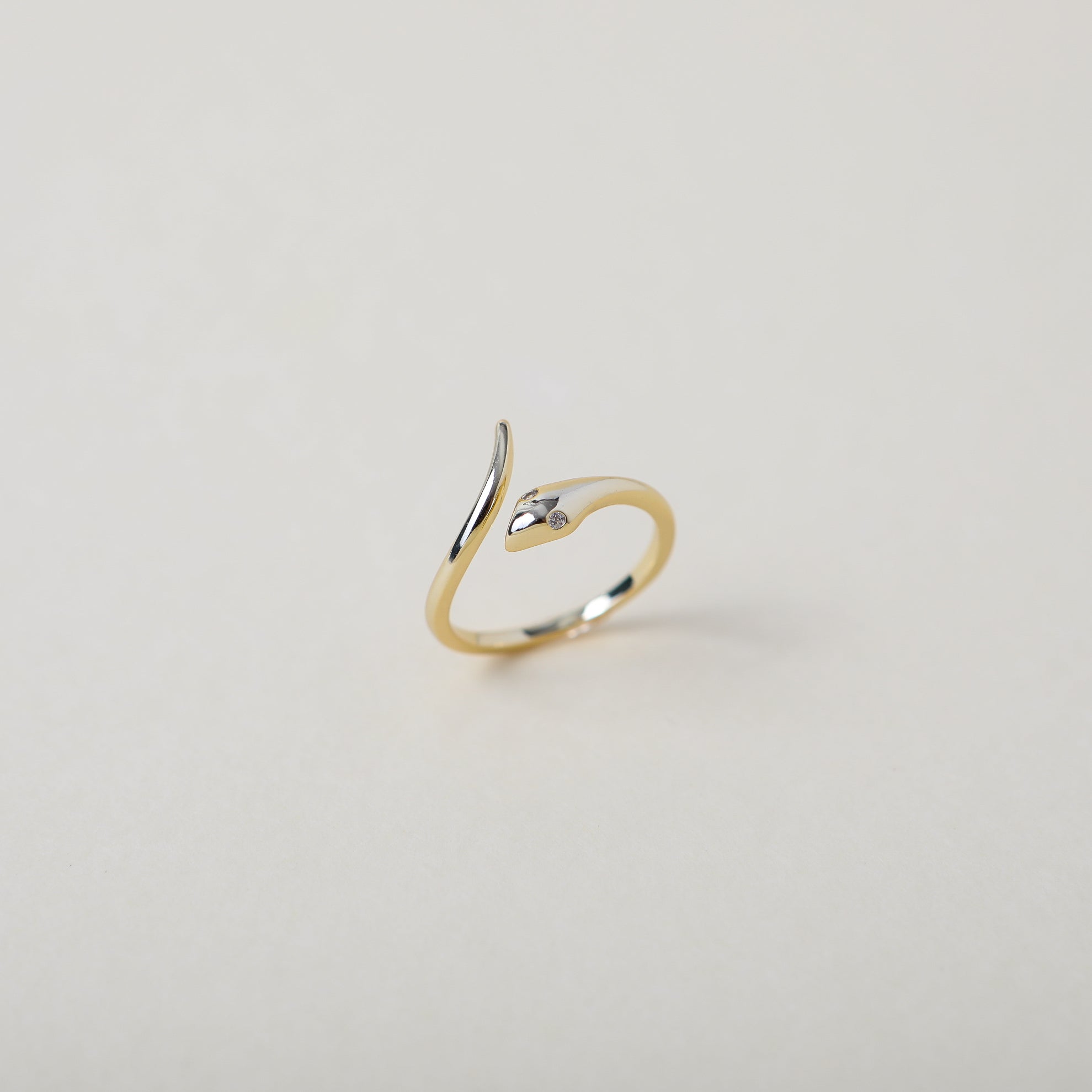 gold open claw twisted serpent ring with crystal eyes