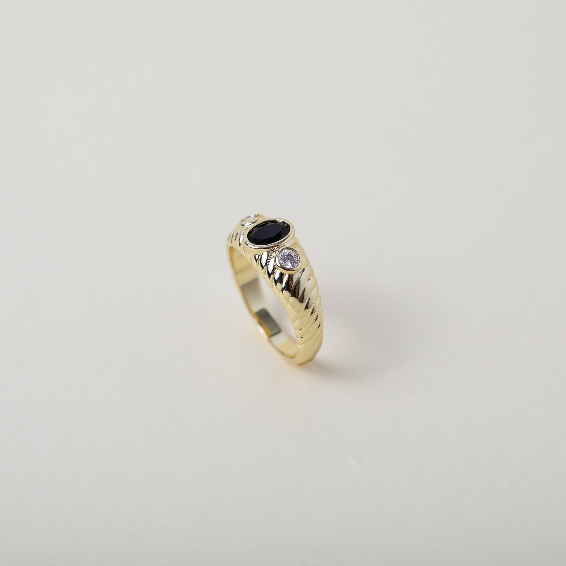 vintage heirloom style ring. Featuring the classic croissant style pattern accented with an onyx coloured crystal
