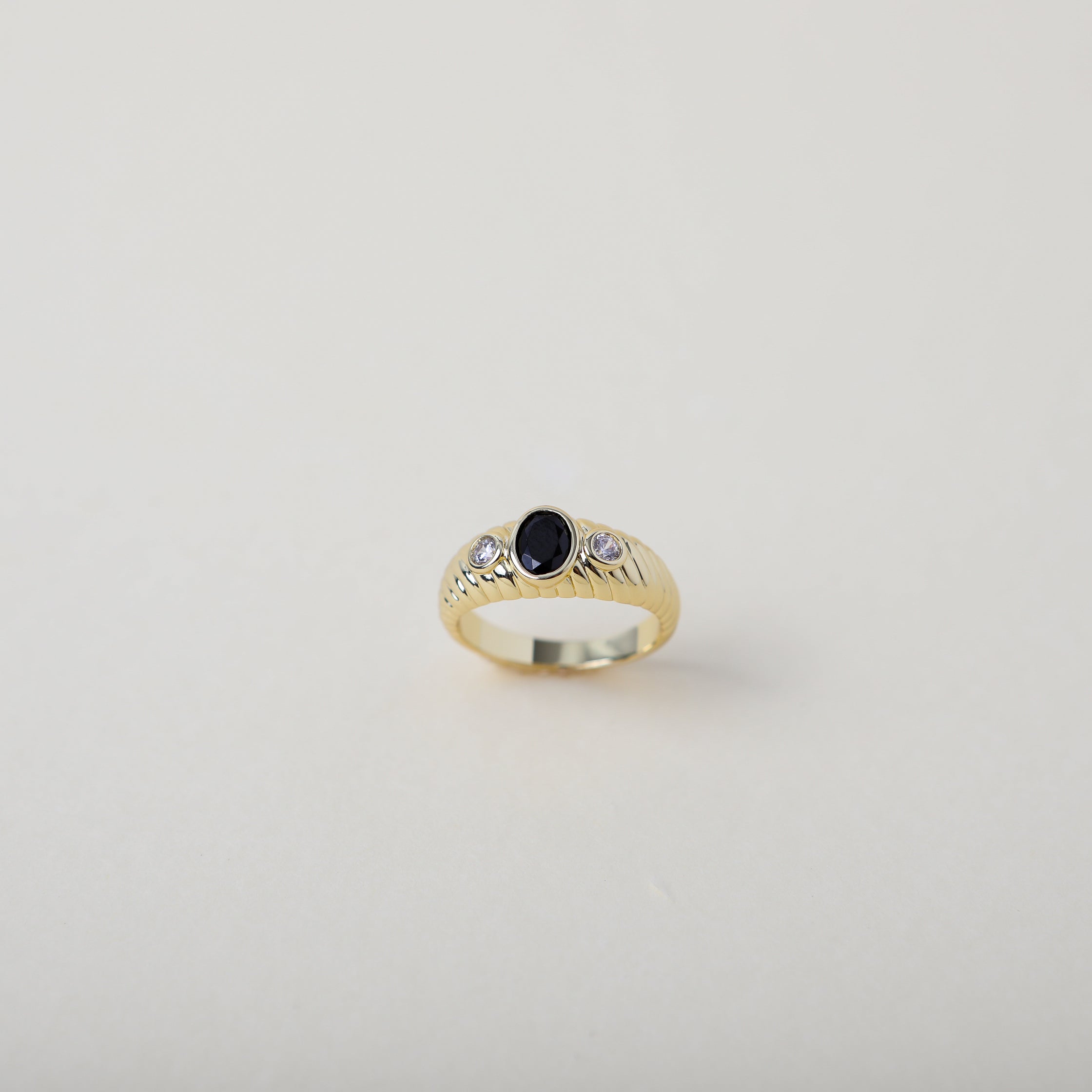 vintage heirloom style ring. Featuring the classic croissant style pattern accented with an onyx coloured crystal