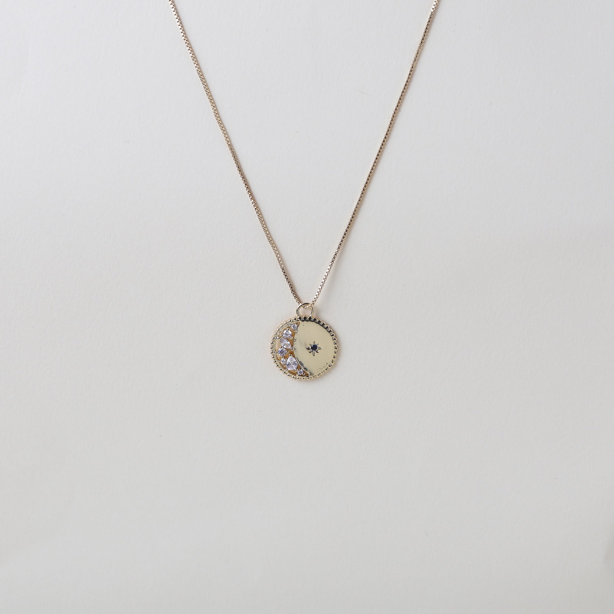 gold crescent moon pendant necklace, accented with crystals