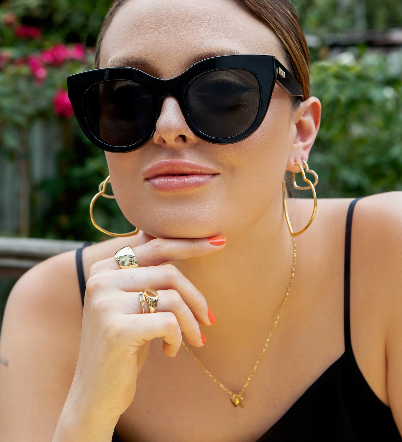 model wears peridot coloured crystal and gold ring