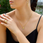 Crystal Butterfly Botanical charm worn with a gold heart charm