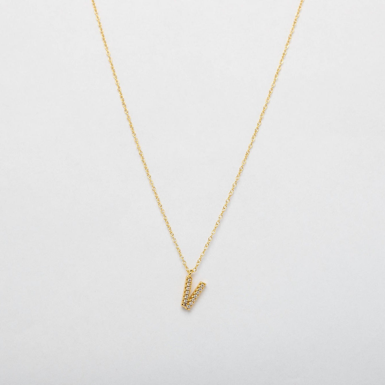 gold necklace with alphabet charm