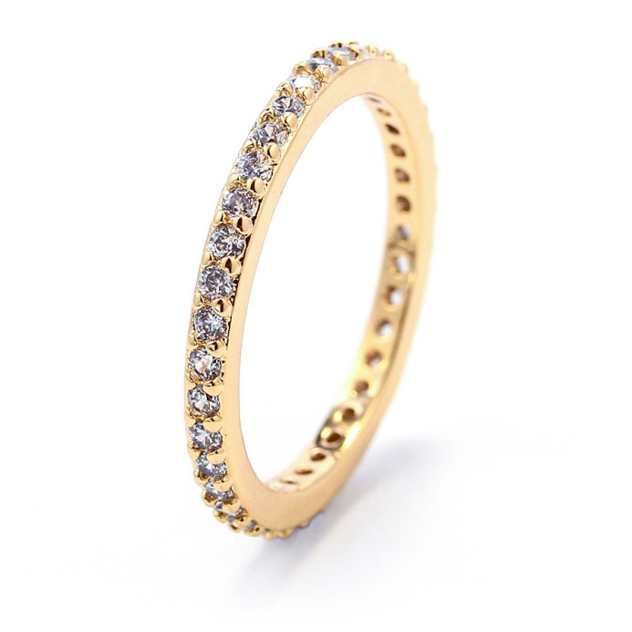 Crystal accented gold eternity ring