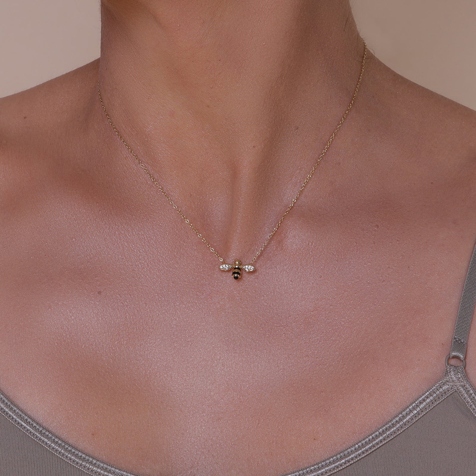Gold chain with gold and crystal accented honey bee pendant