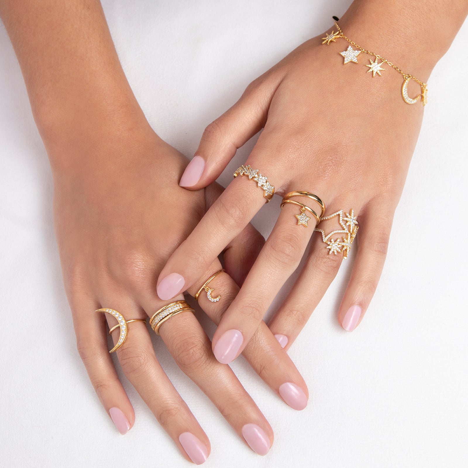 Delicate gold ring with crystal accented star charm