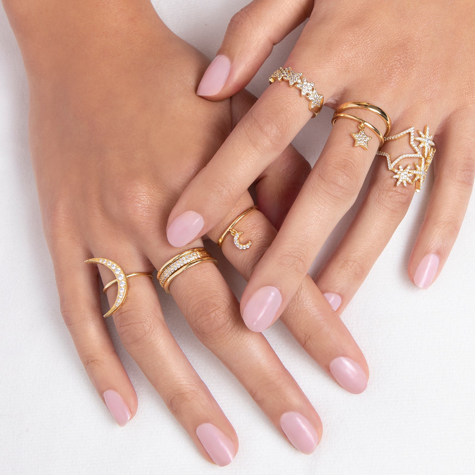 Delicate gold ring with crystal accented crescent moon charm