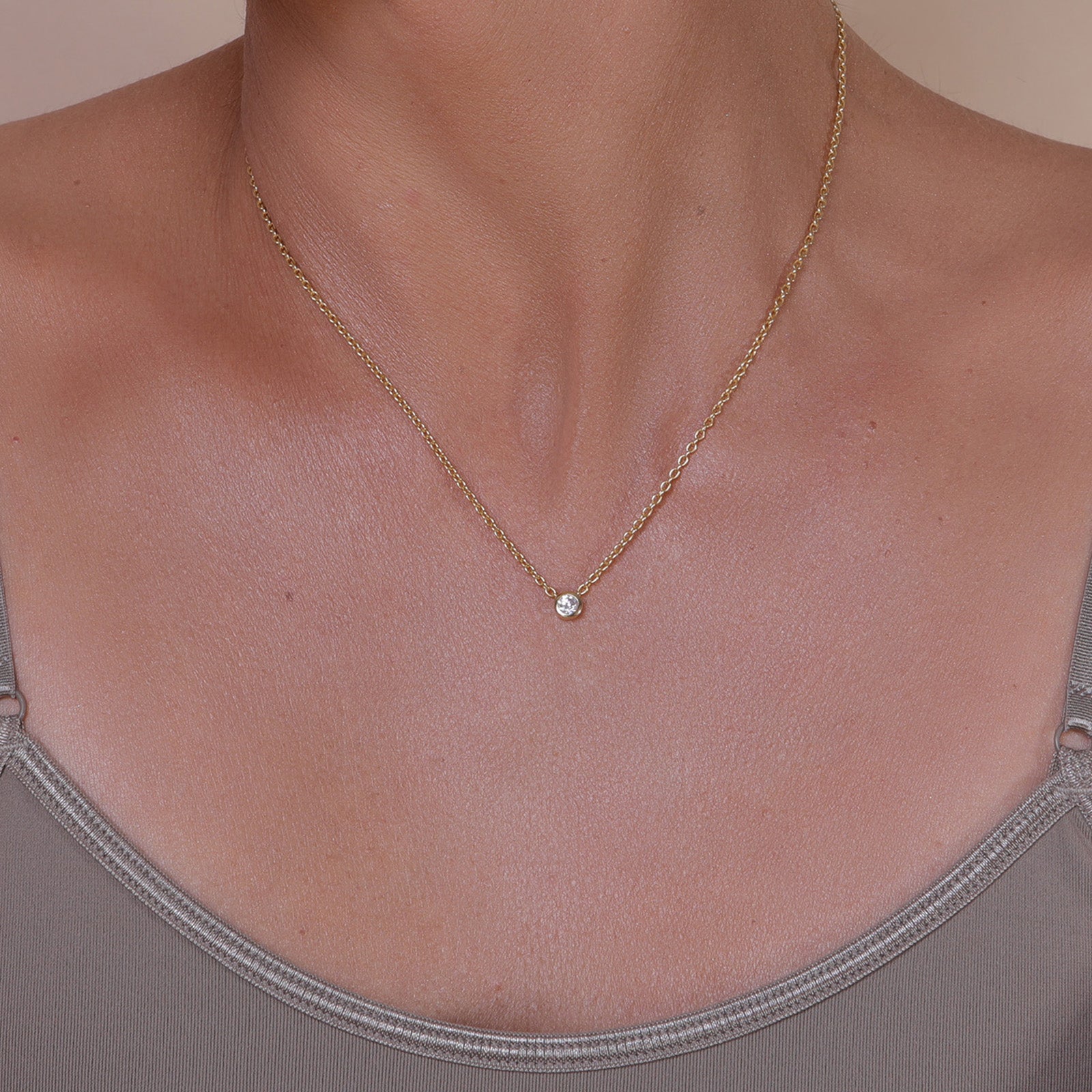Gold chain with a single crystal pendant