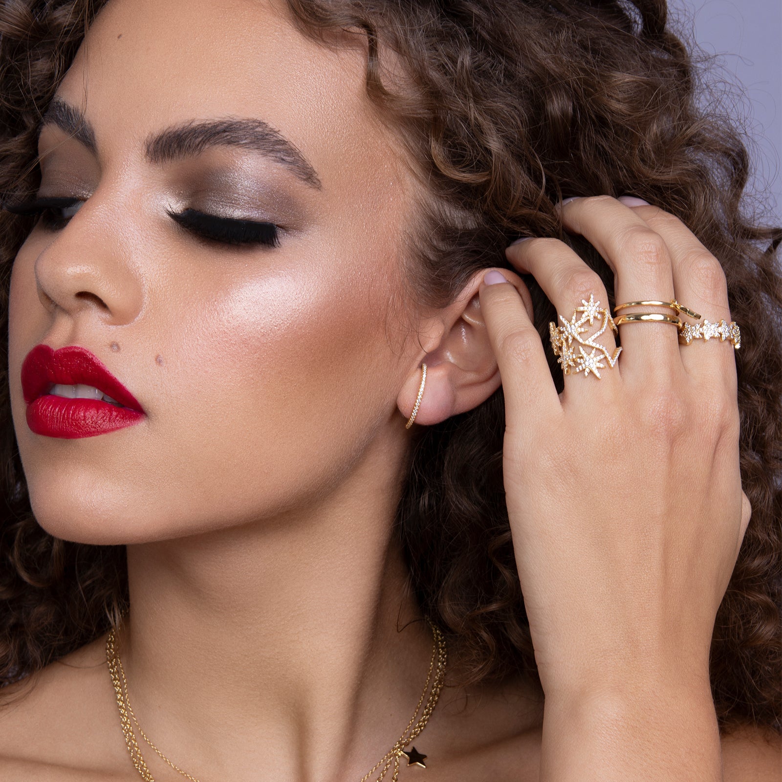 Crystal accented gold star ring