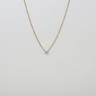 delicate Gold chain with a single crystal pendant