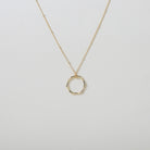 Gold hexagon pendant on a micro bead accented gold chain