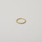 Crystal accented gold eternity ring