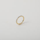 Crystal accented gold eternity ring