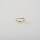 Crystal accented gold eternity ring