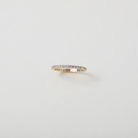 Crystal accented gold eternity ring