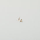 Micro gold star studs with crystal accents