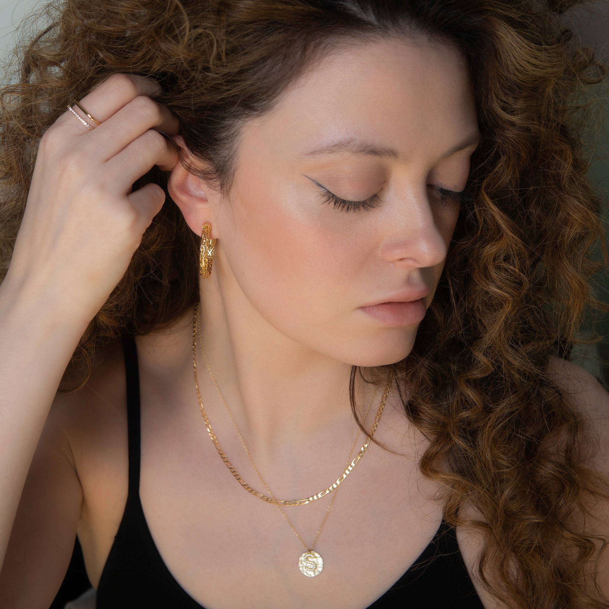 crystal accented alphabet charm on the distressed coin necklace